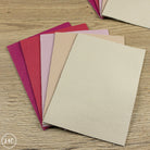 Collection of textured fairground leather panels in various colors on a wooden surface
