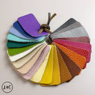 Color swatch card with various leather textures and colors on a neutral background
