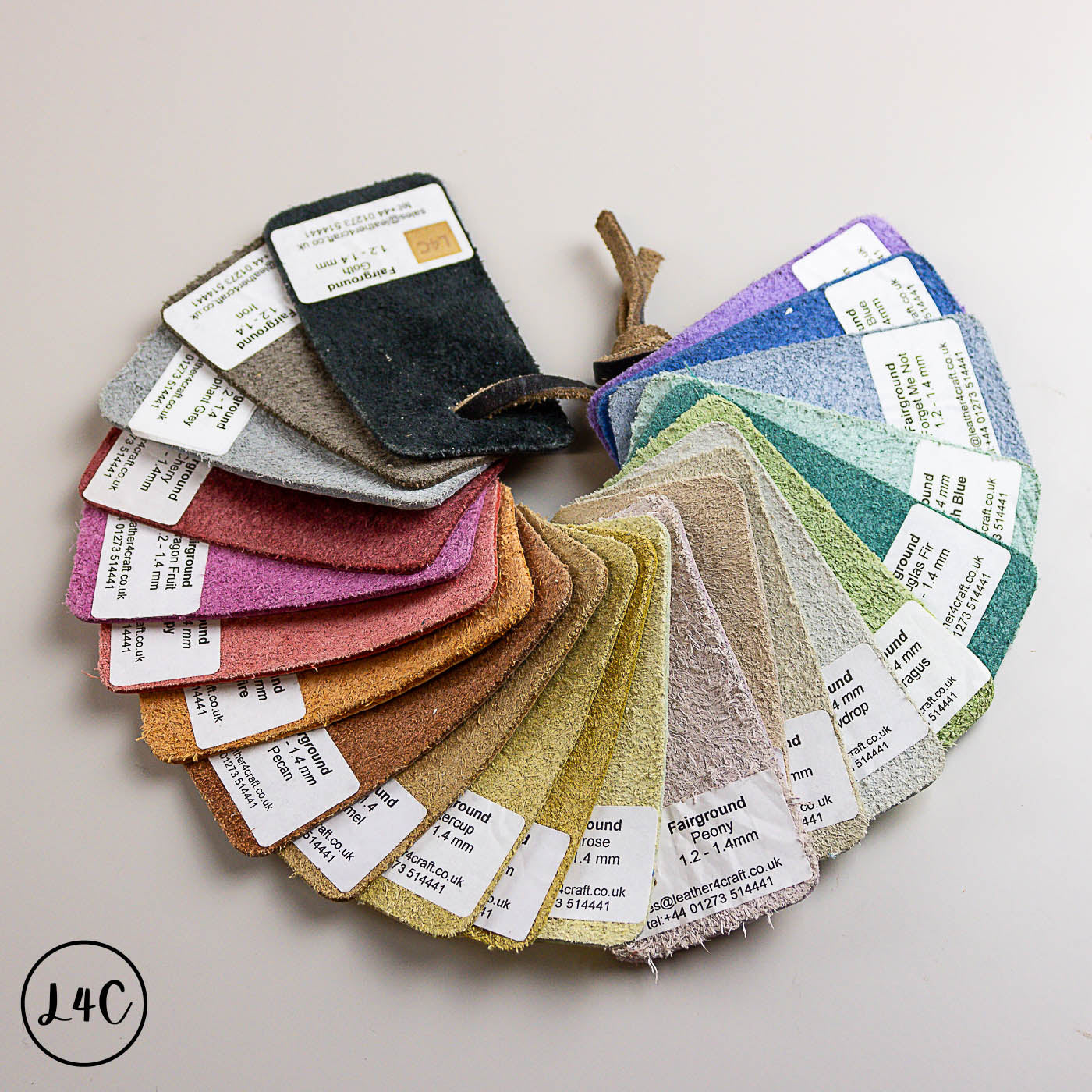 Color swatch card with various fabric samples and labels on a light background