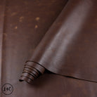 Brown leather hide rolled up.