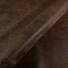 Brown leather hide with texture, visible grain and wear.