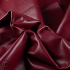 Close-up of red leather hide with folds