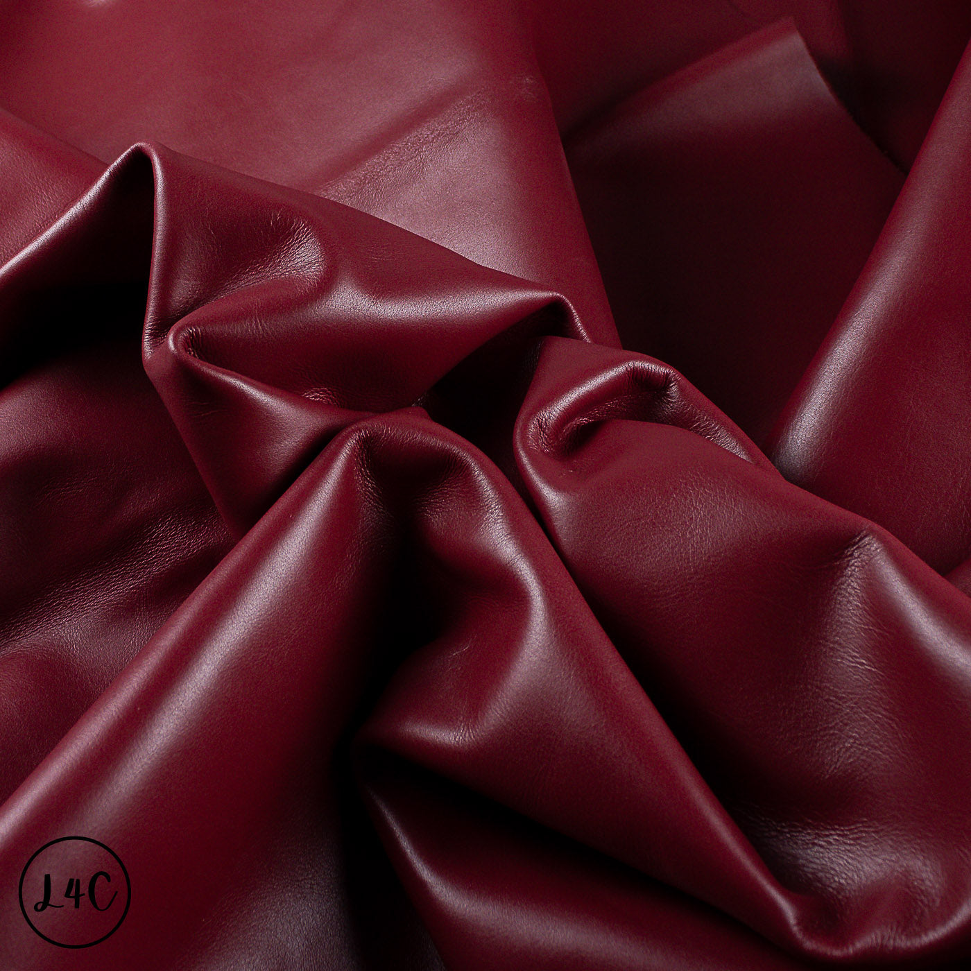 Close-up of red leather hide with folds