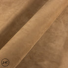 Close-up of brown leather hide with texture.
