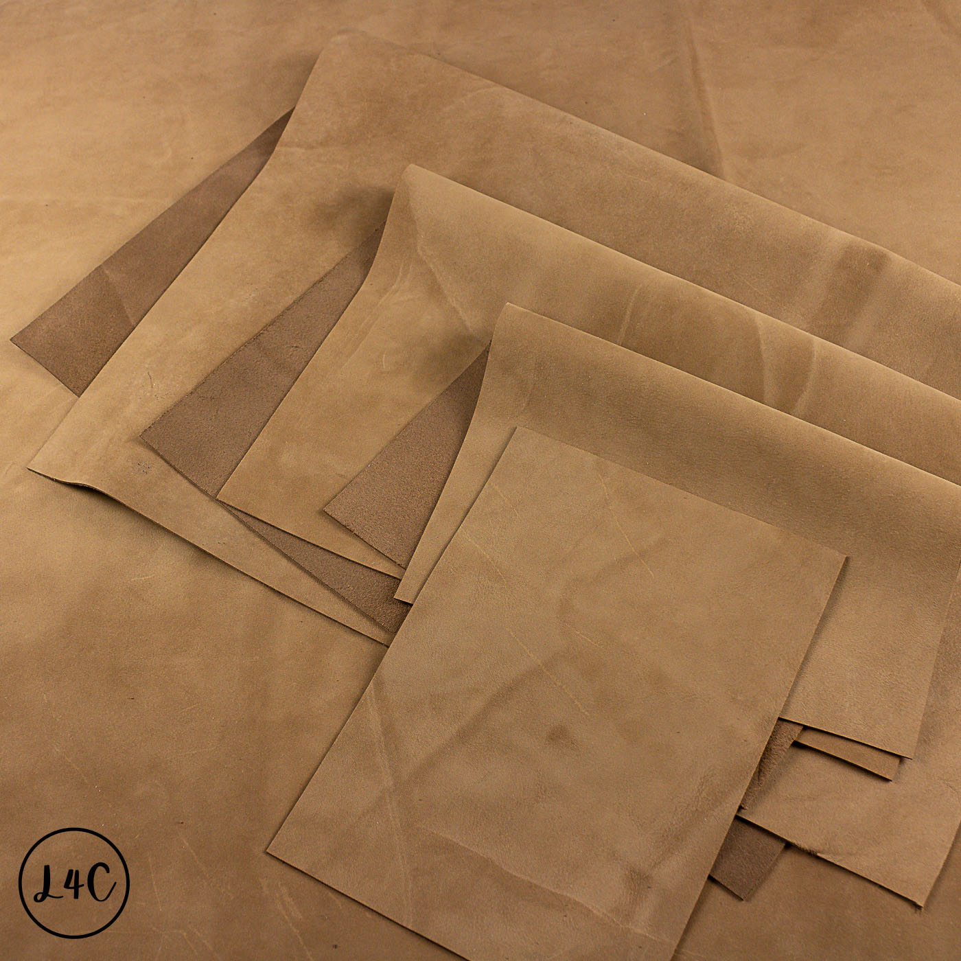 Stack of brown nubuck leather panels on a brown background