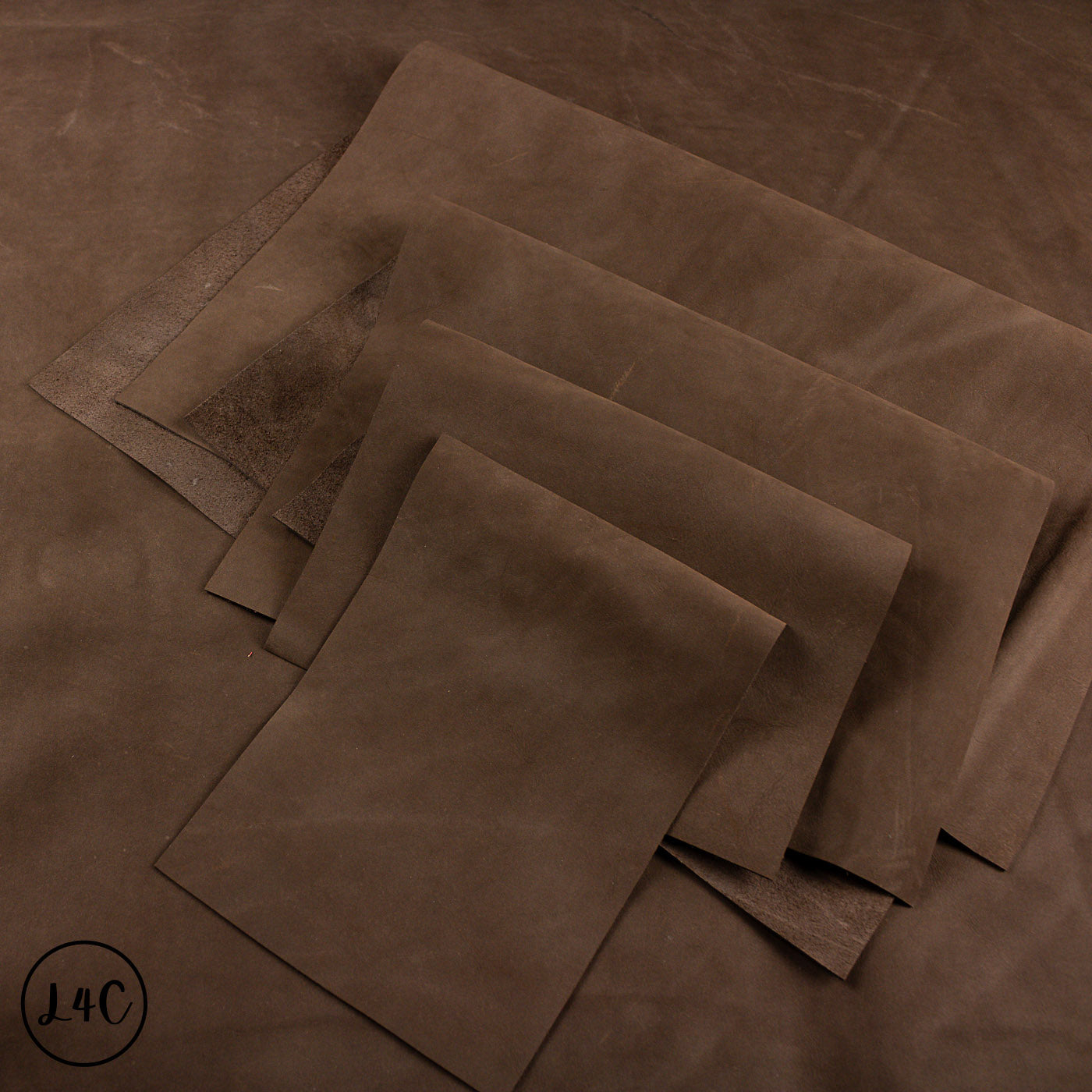 Brown leather panels on a brown leather surface.