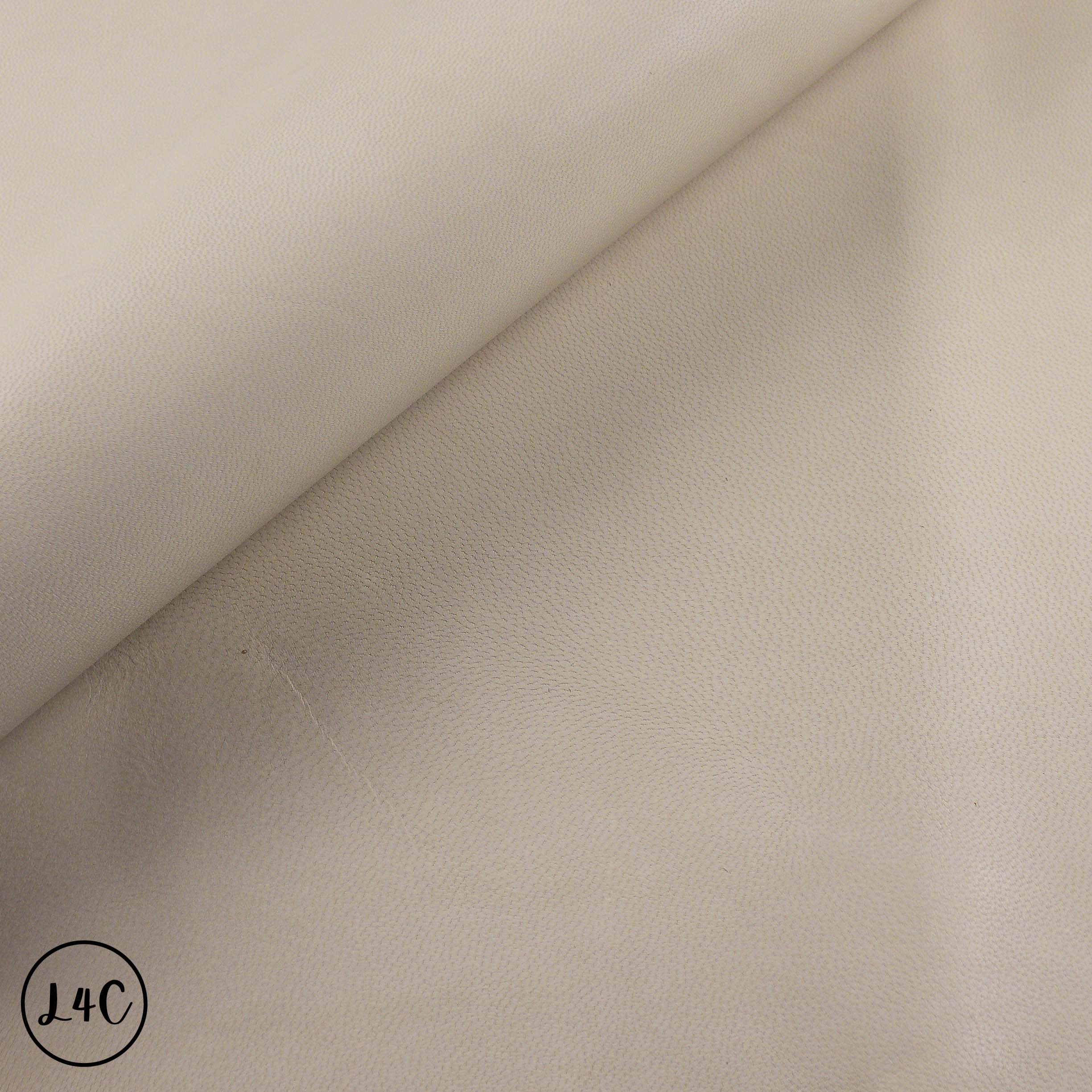 Beige leather fabric with a slight texture