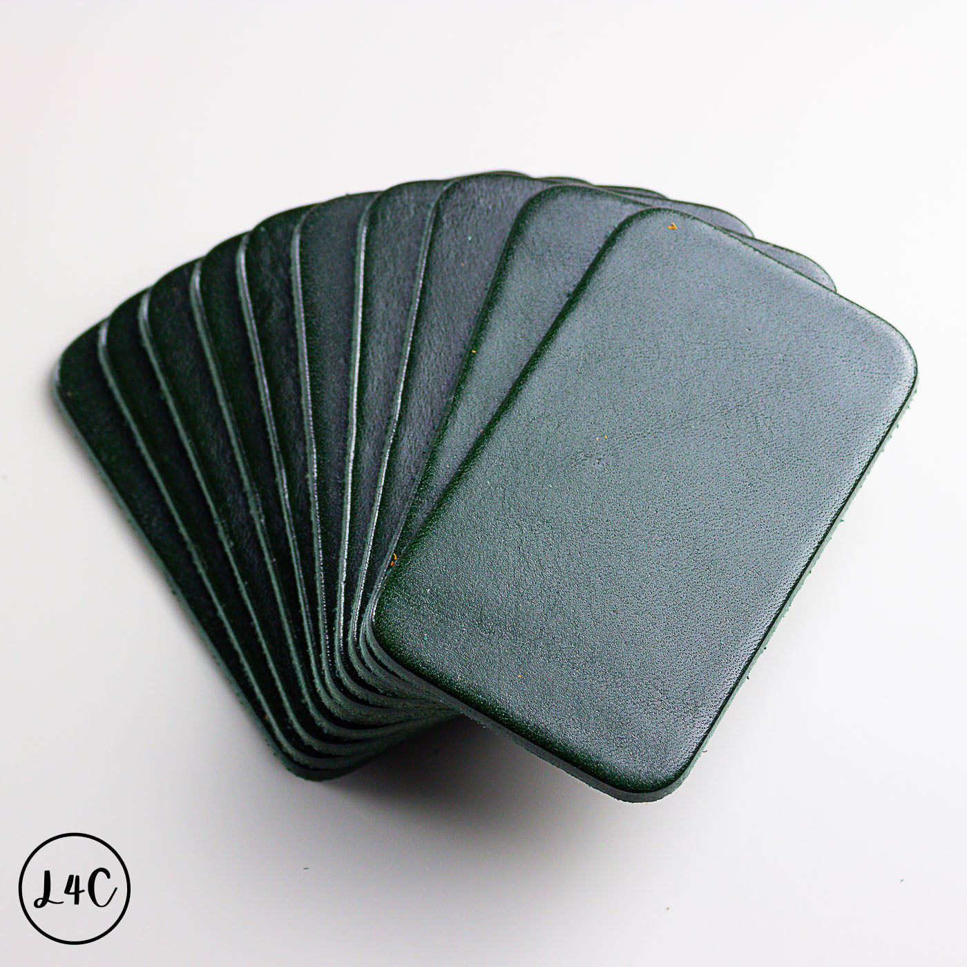 Set of olive leather sheets on a white background