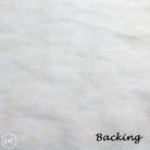 Close-up of white leather texture with 'Backing' text