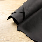 Black leather on a wooden surface