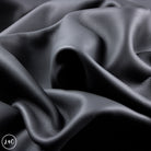 Close-up of dark gray leather with visible texture