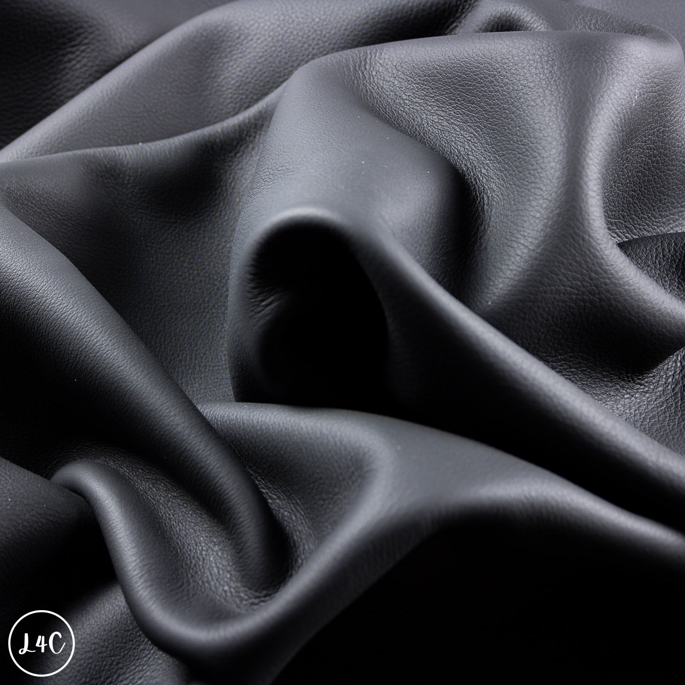 Close-up of dark gray leather with visible texture