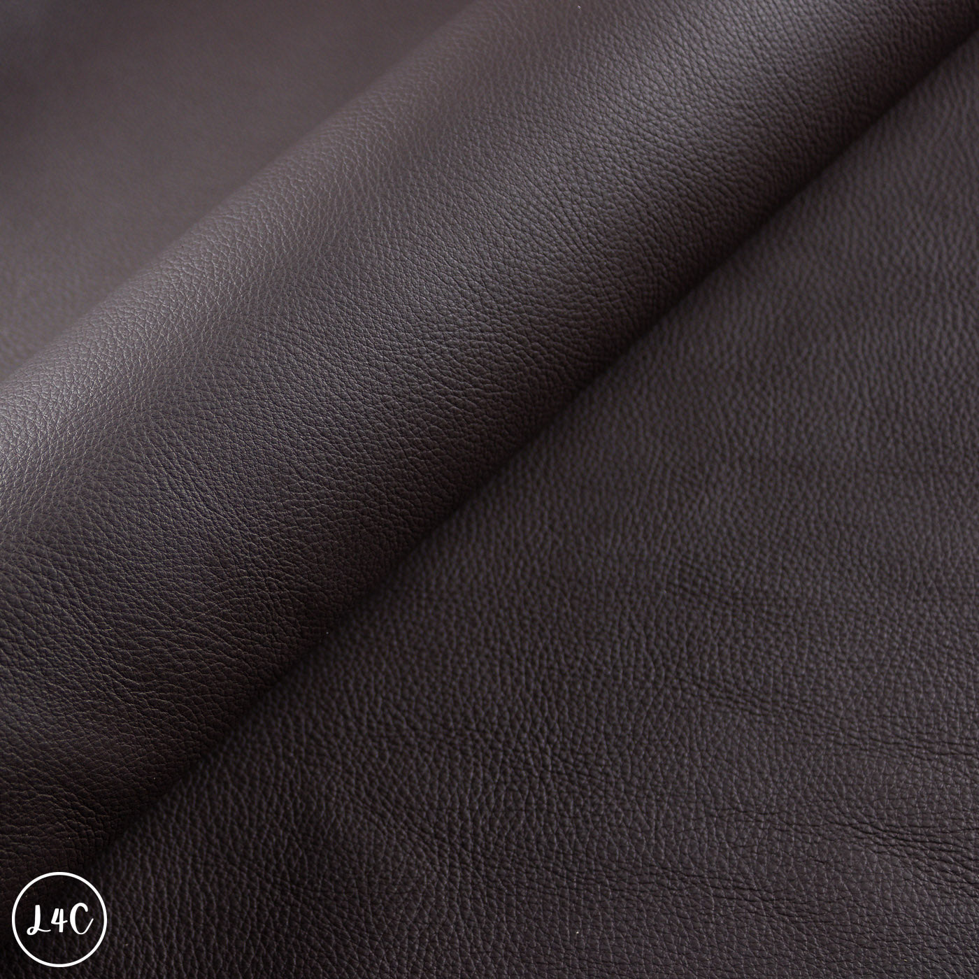Close-up of dark brown leather with visible texture