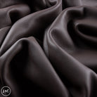 Close-up of dark brown leather with visible texture