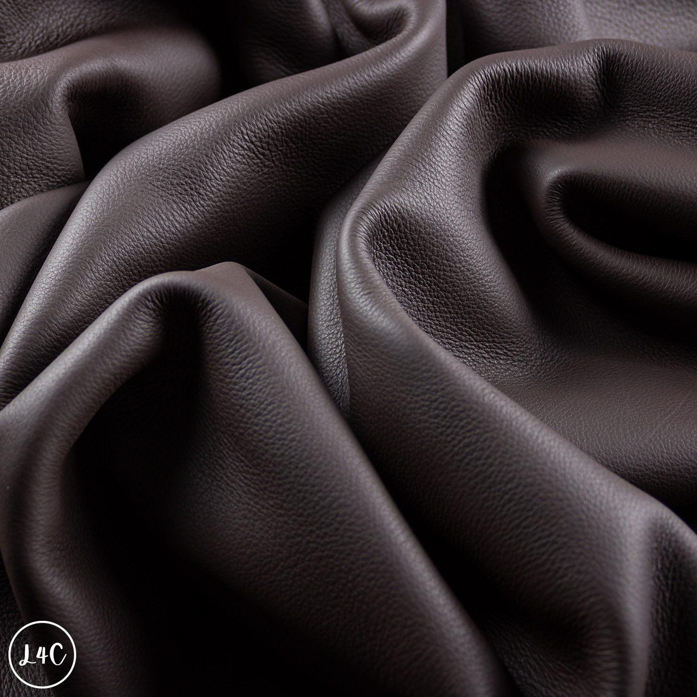 Close-up of dark brown leather with visible texture