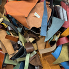 Collection of multicolored leather strips in various shades.