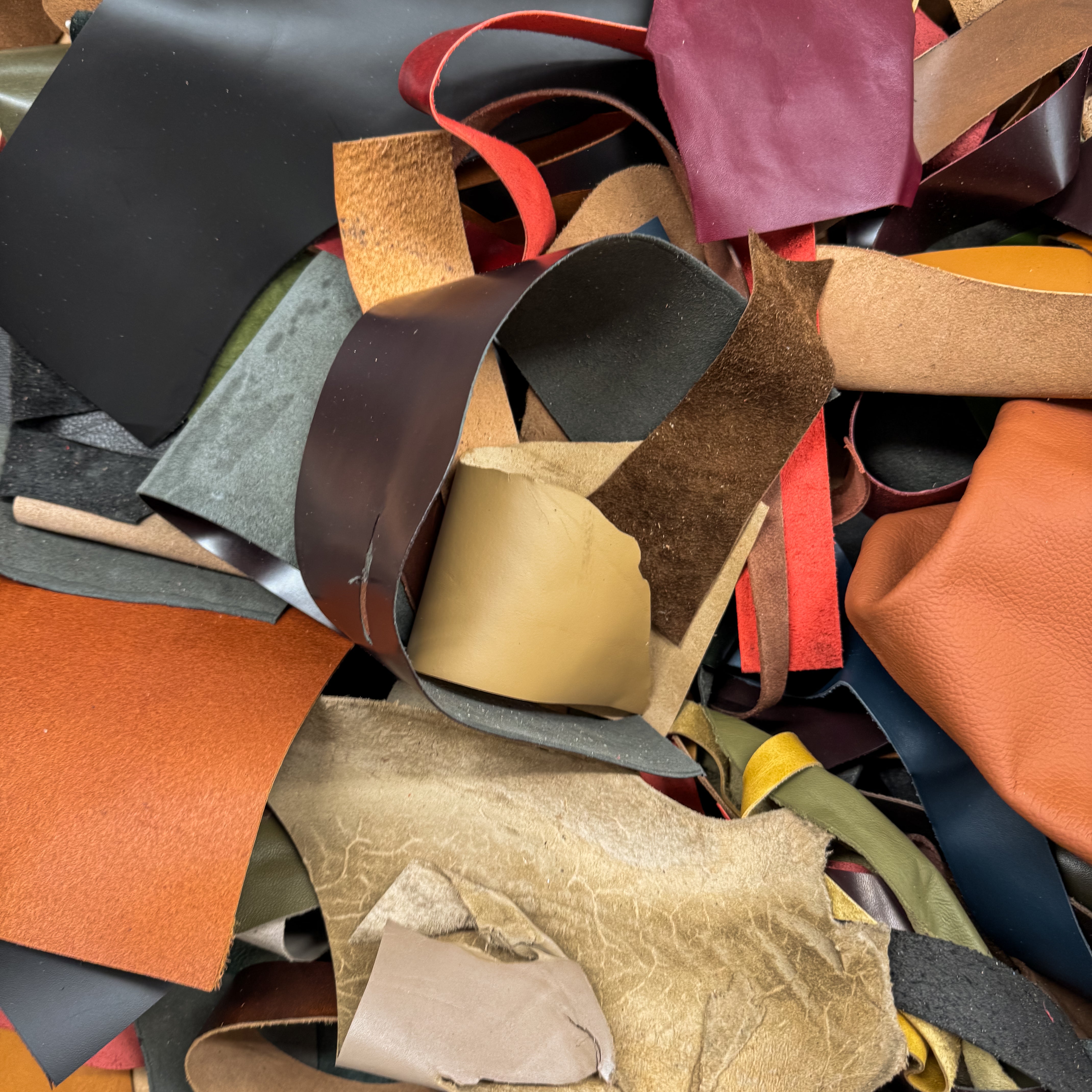 Collection of various leather samples in different colors and textures.