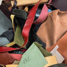 Collection of multicolored leather samples with a label.