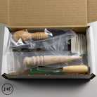 Wooden tools in a cardboard box with visible brand logo.
