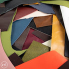 Collection of various leather off cuts in different colors and textures.