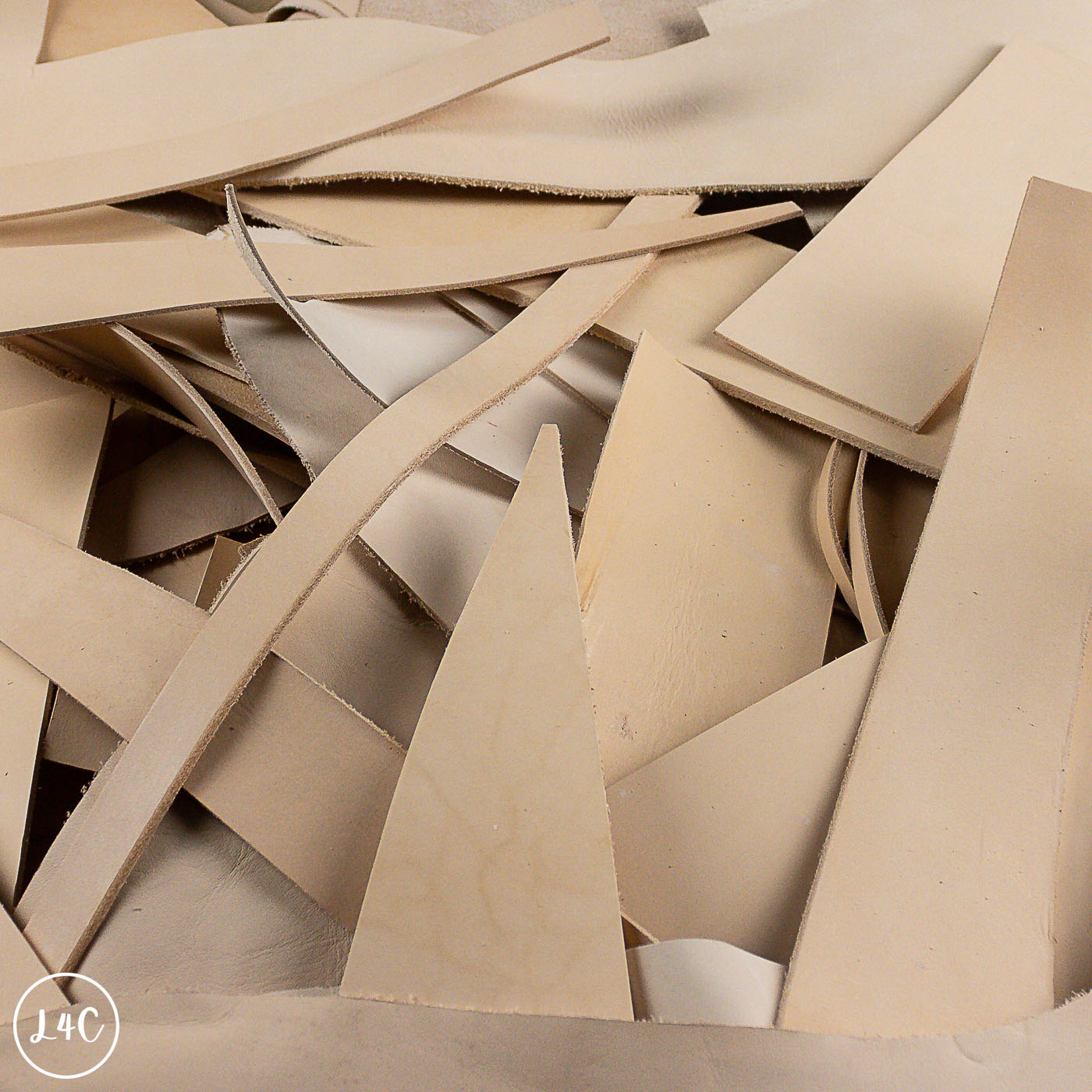 Stack of beige leather pieces with a textured surface
