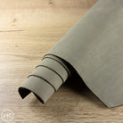 Roll of mushroom leather on a wooden floor