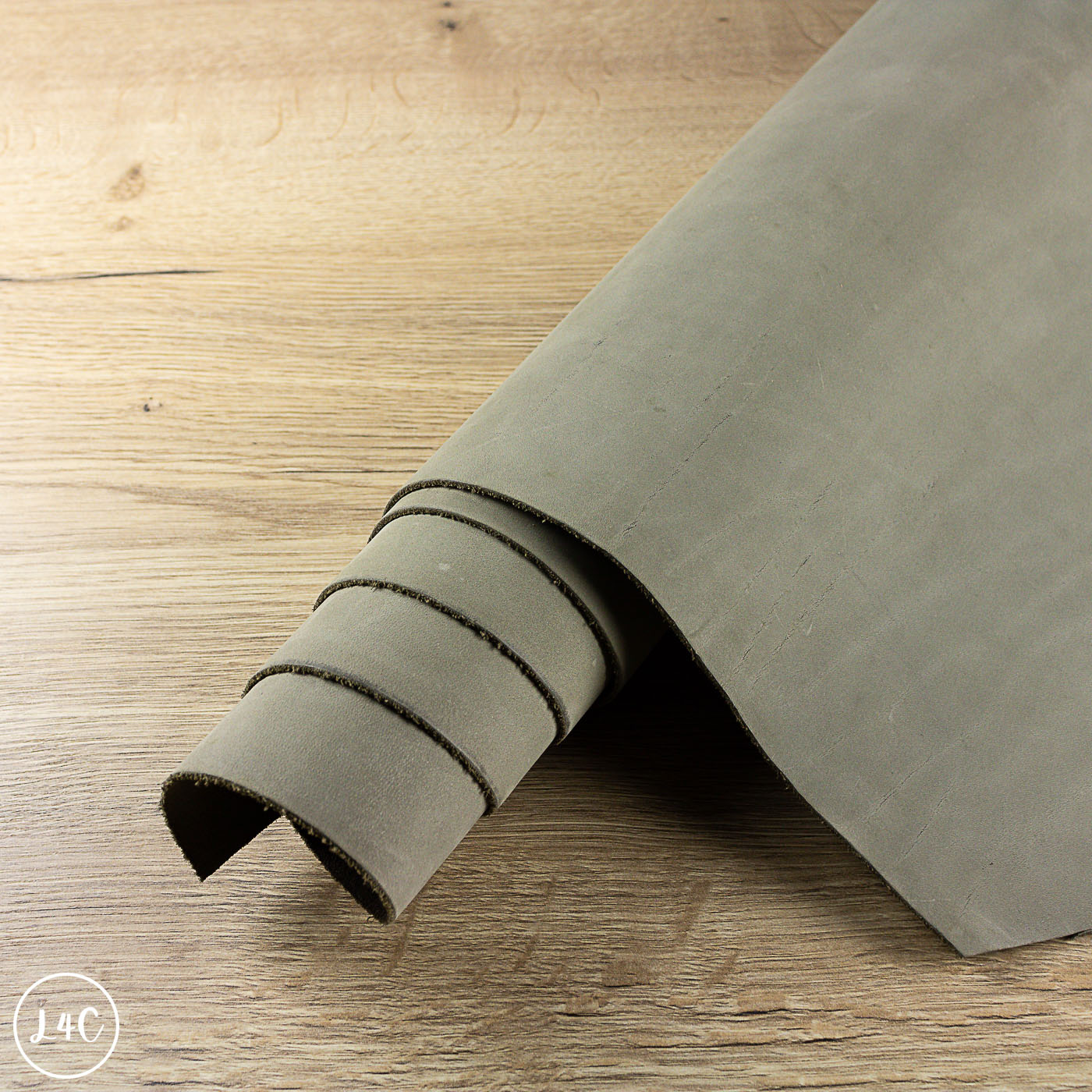 Roll of mushroom leather on a wooden floor