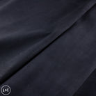 Dark blue fabric with a subtle texture