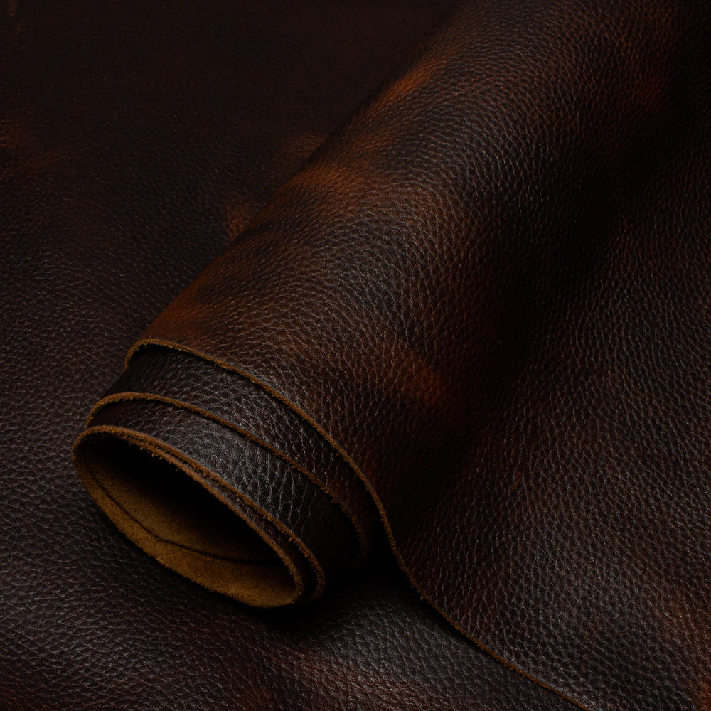 Close-up of brown leather fabric with visible texture