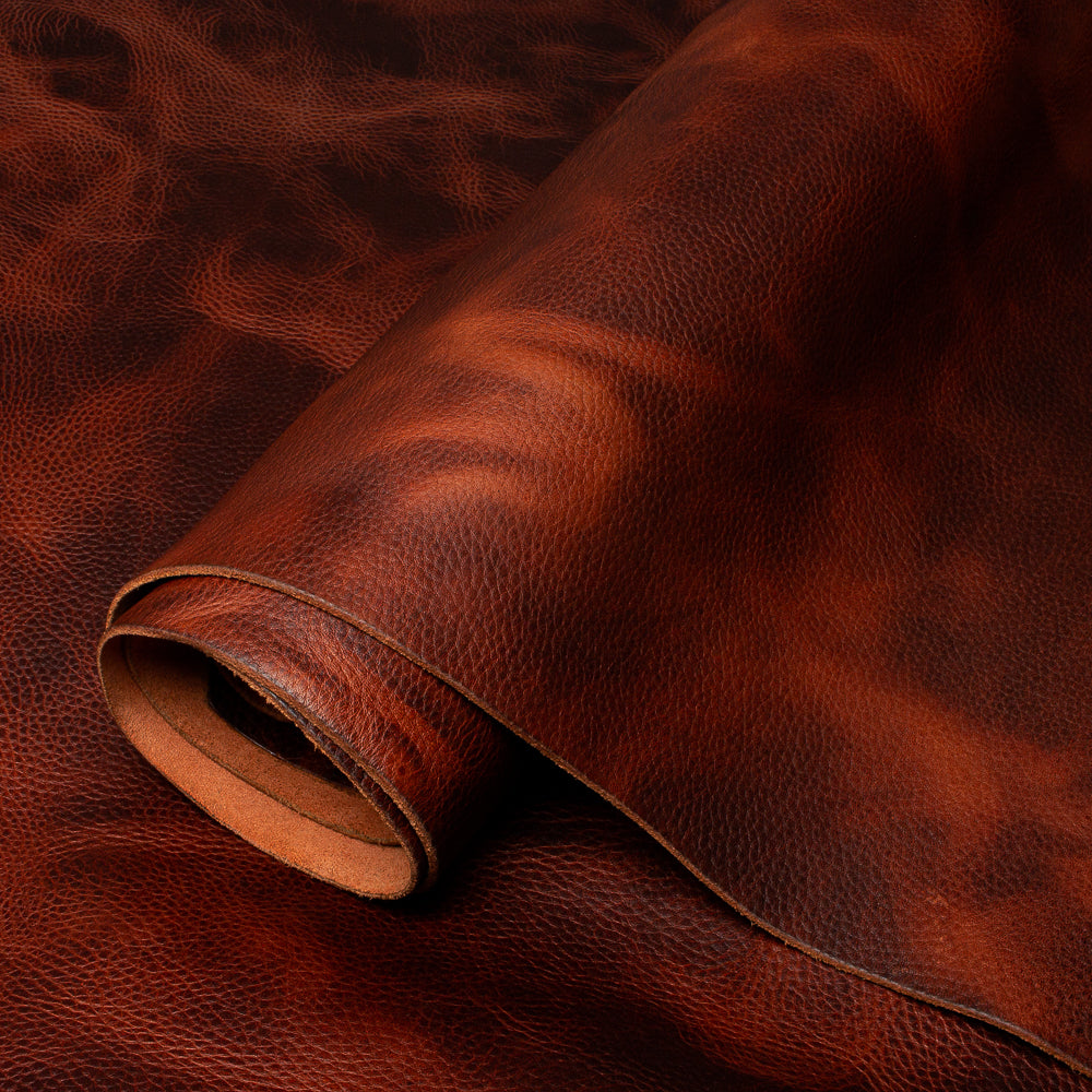 Close-up of brown leather fabric with visible texture