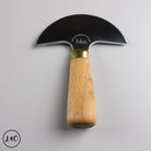 Knife with a wooden handle and metal blade on a gray background