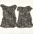 Two snow leopard print hides on a white background