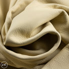 Close-up of beige leather with visible texture