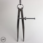 Black leather crafting tool on a light gray background