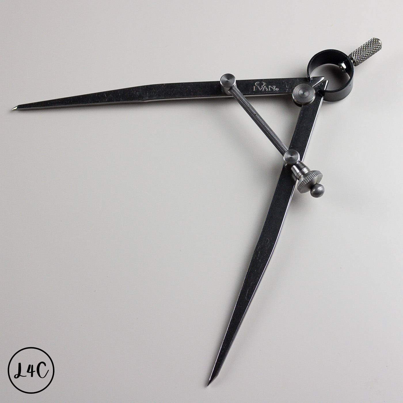 Metal wing divider on a light gray background