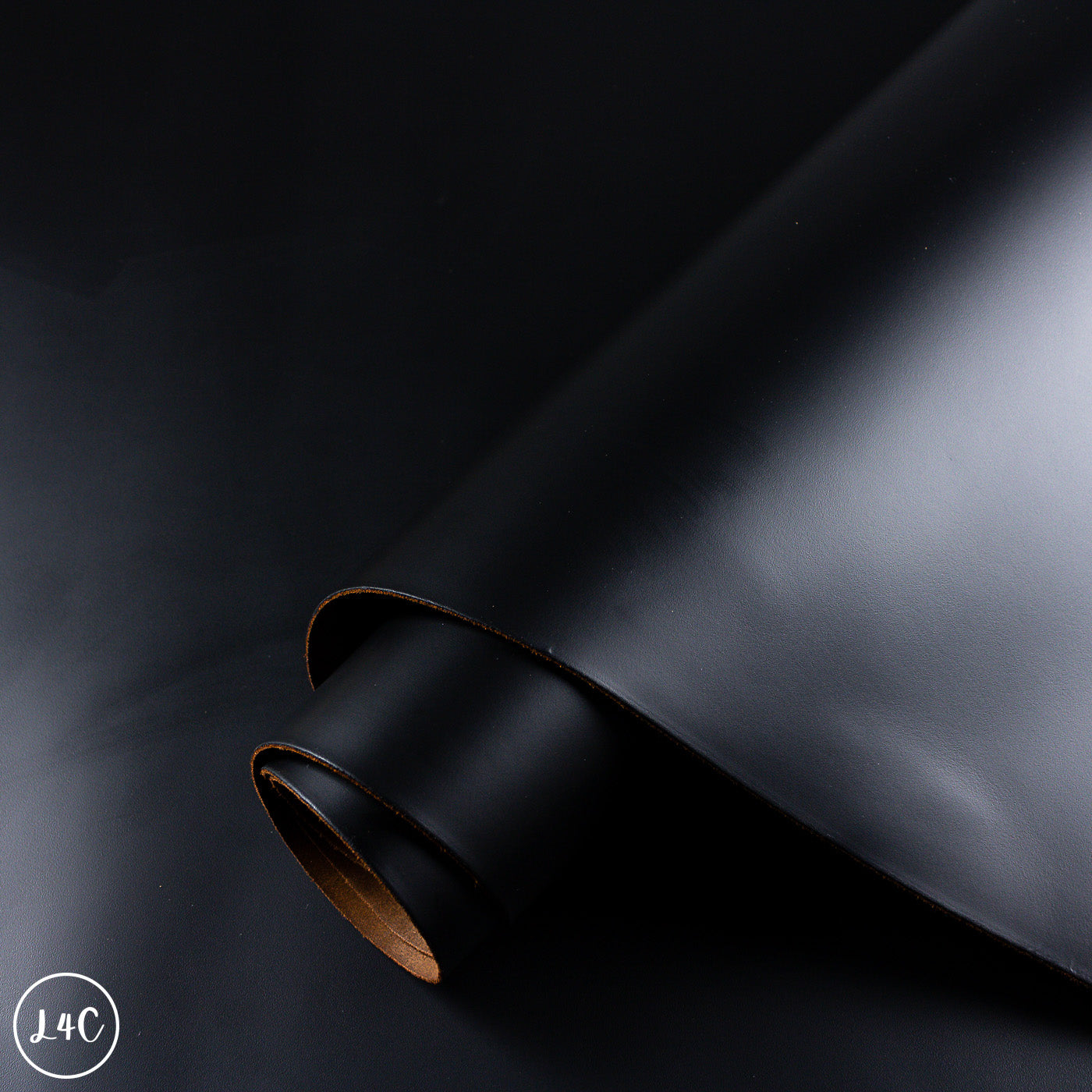Dark black leather hide on a black background