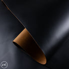Brown leather hide on a dark background