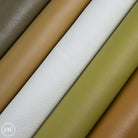 Close-up of leather rolls in various colors.