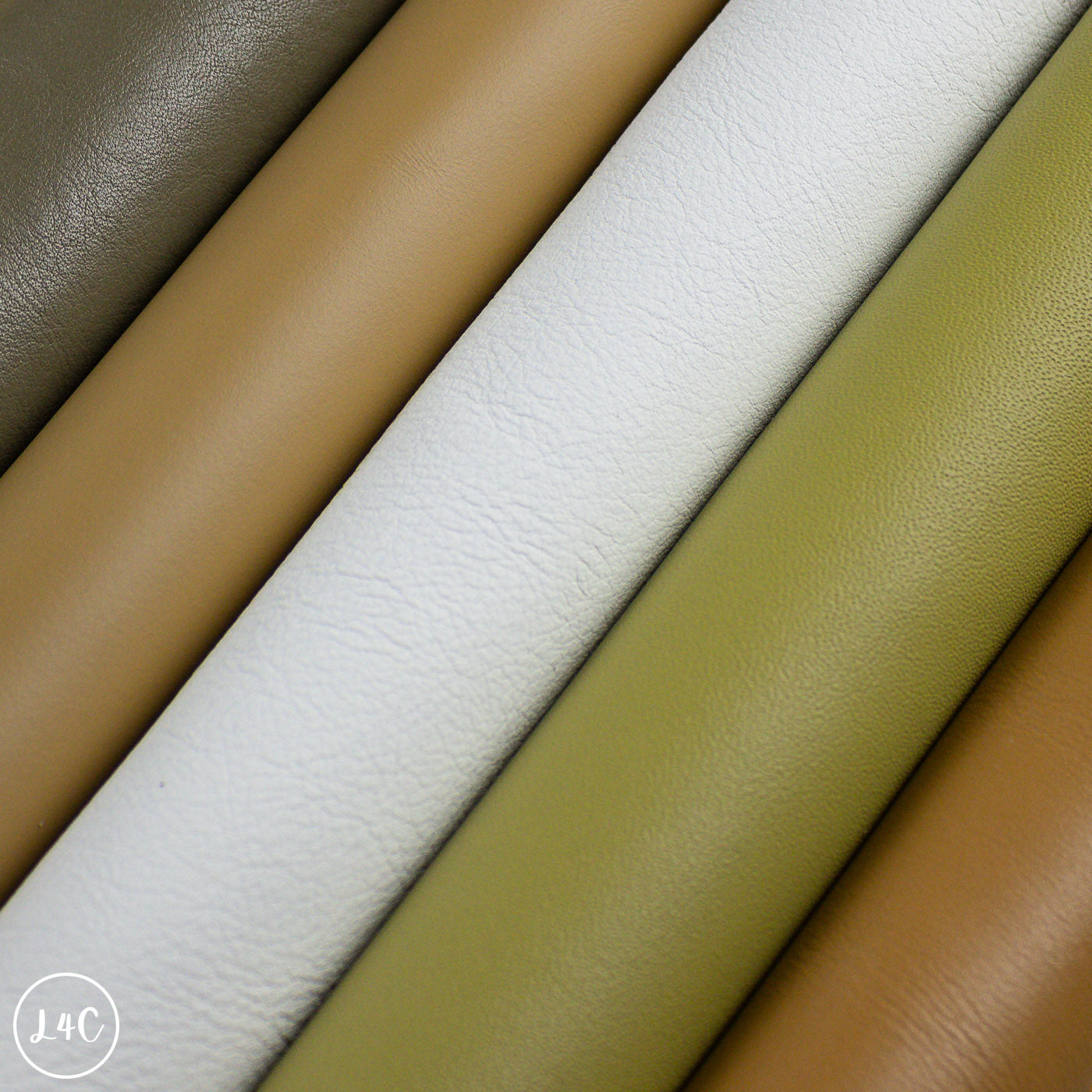 Close-up of leather rolls in various colors.