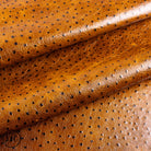 Close-up of brown perforated leather fabric