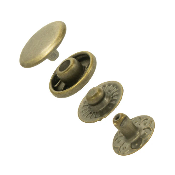 Set of five bronze-colored metal buttons on a white background