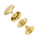Set of gold metal buttons on a white background