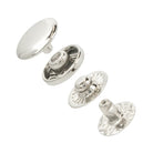 Set of silver metal buttons on a white background