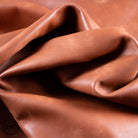 Close-up of brown leather with folds
