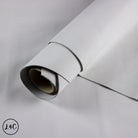 Roll of gray vinyl wrap on a light gray background