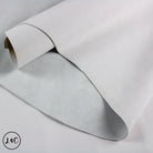 Roll of gray leather on a light gray background